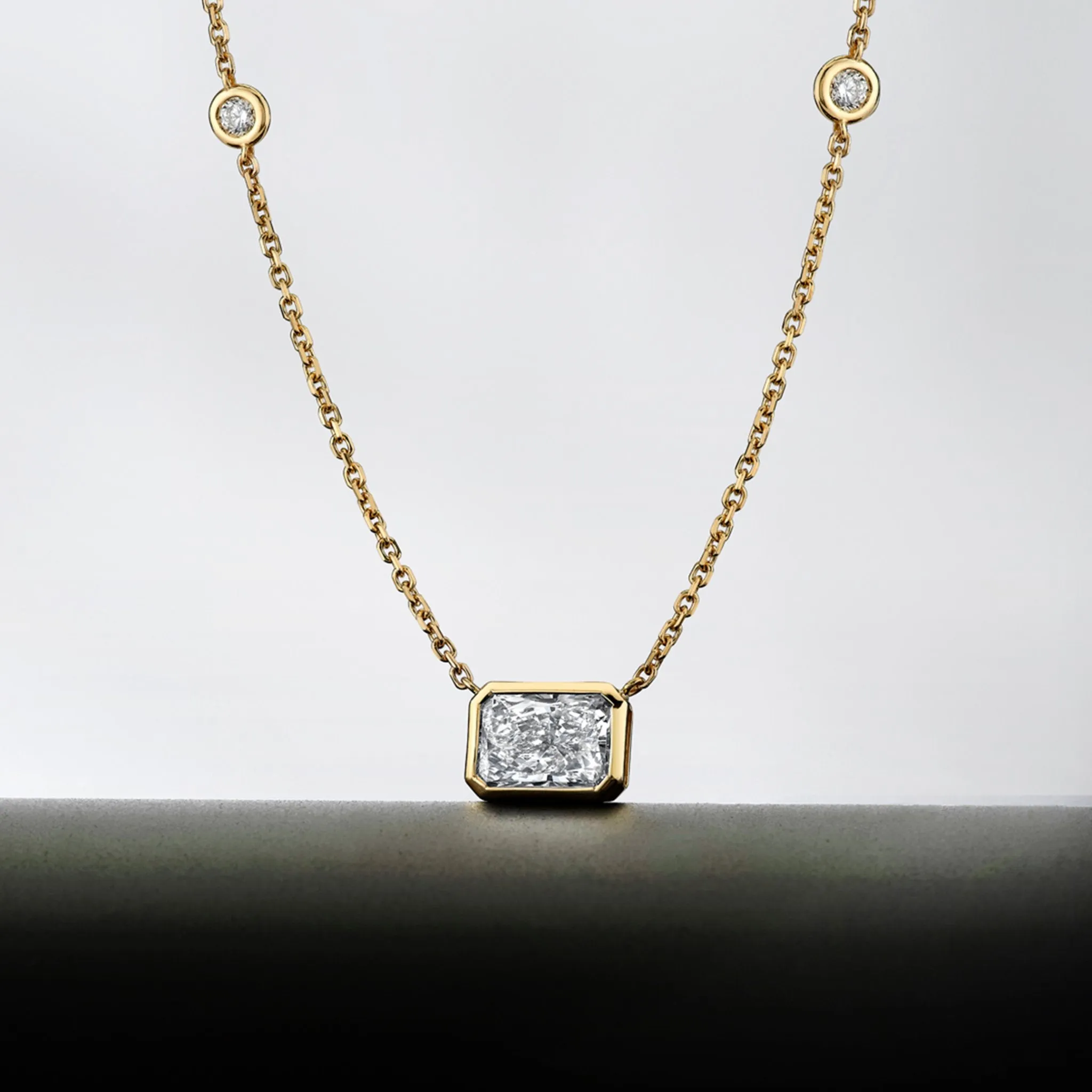 Diamond Station Pendant with Radiant Cut Center Stone