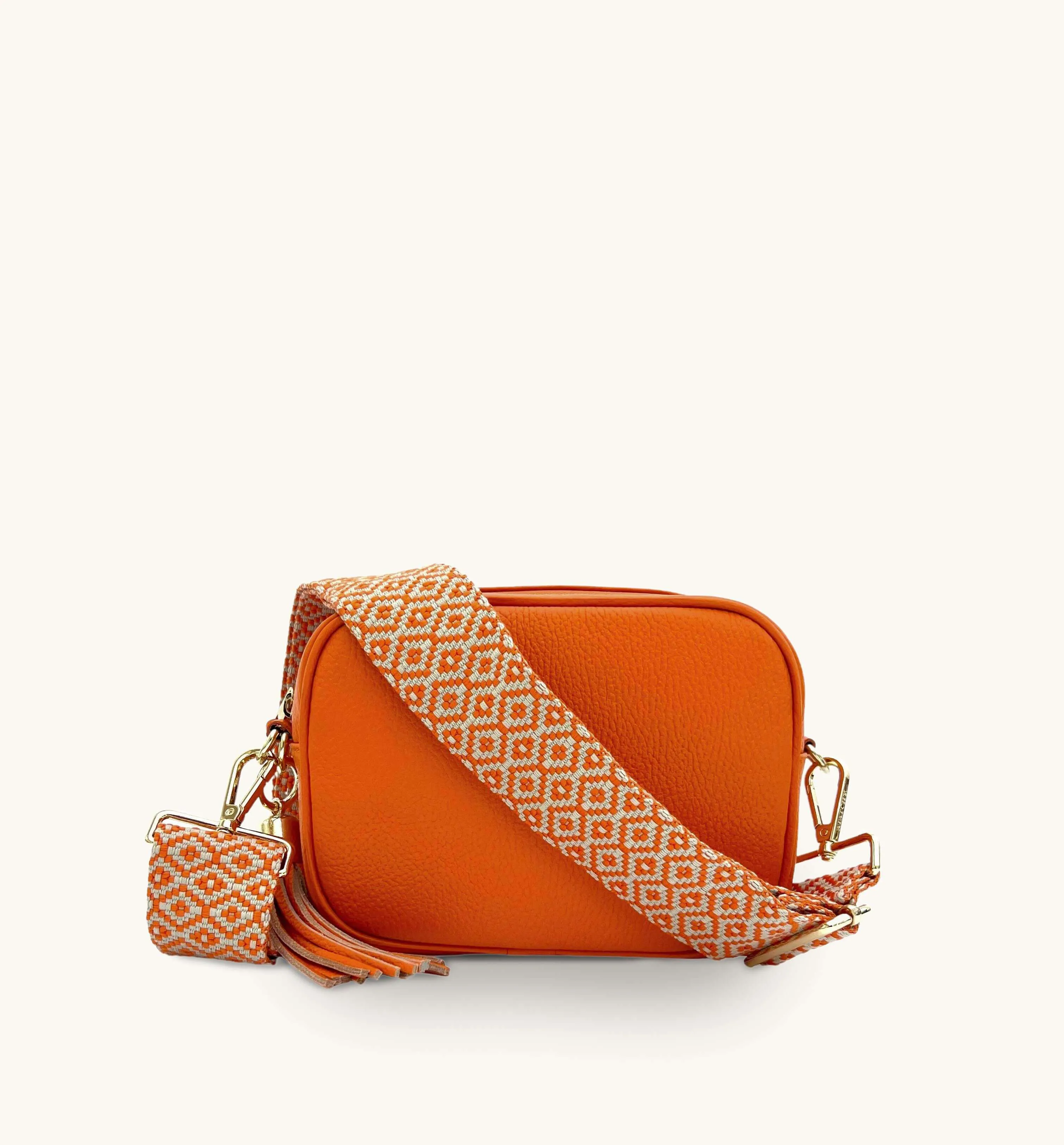 The Tassel Orange Leather Crossbody Bag With Orange Cross-Stitch Strap