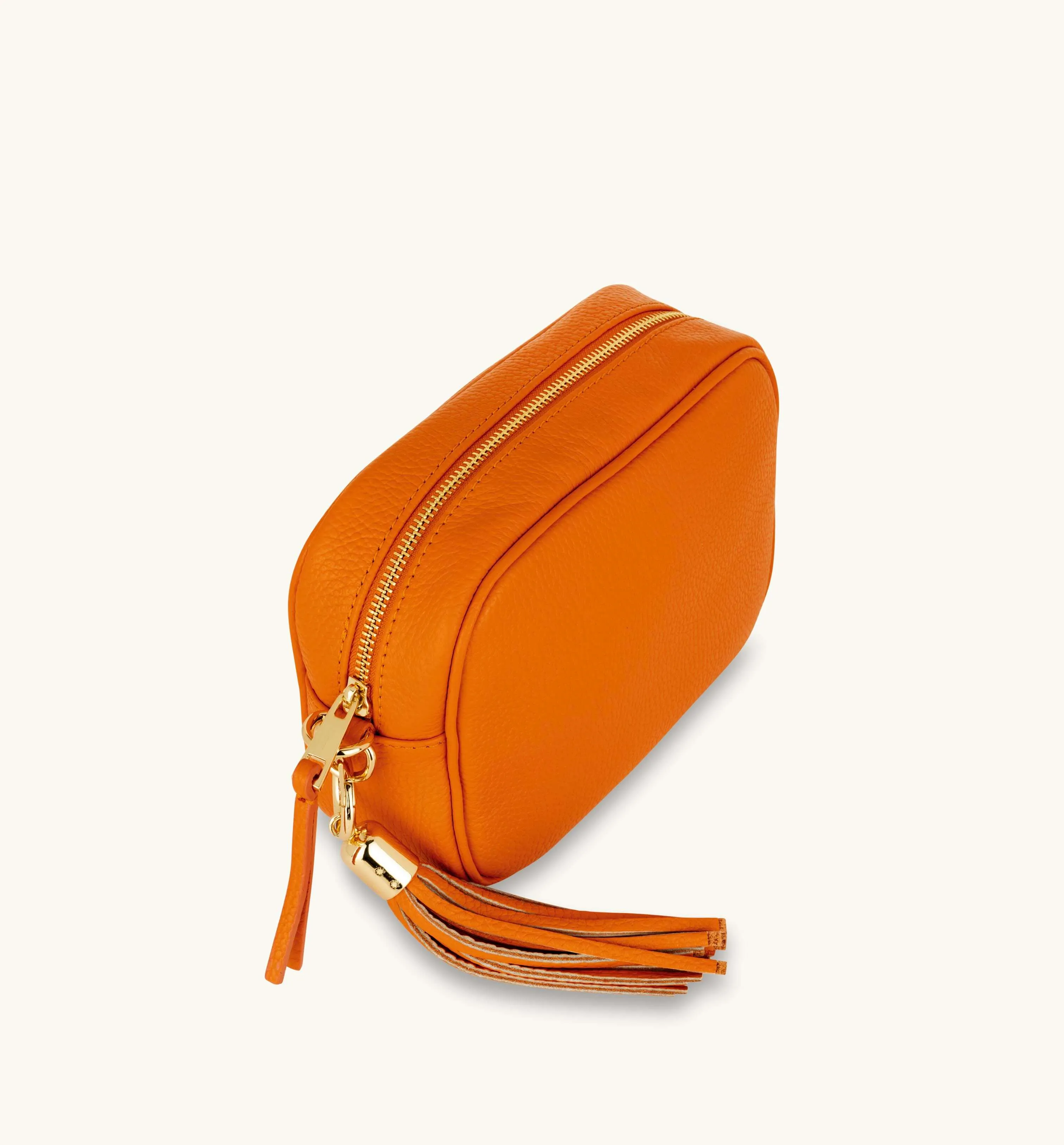 The Tassel Orange Leather Crossbody Bag With Orange Cross-Stitch Strap