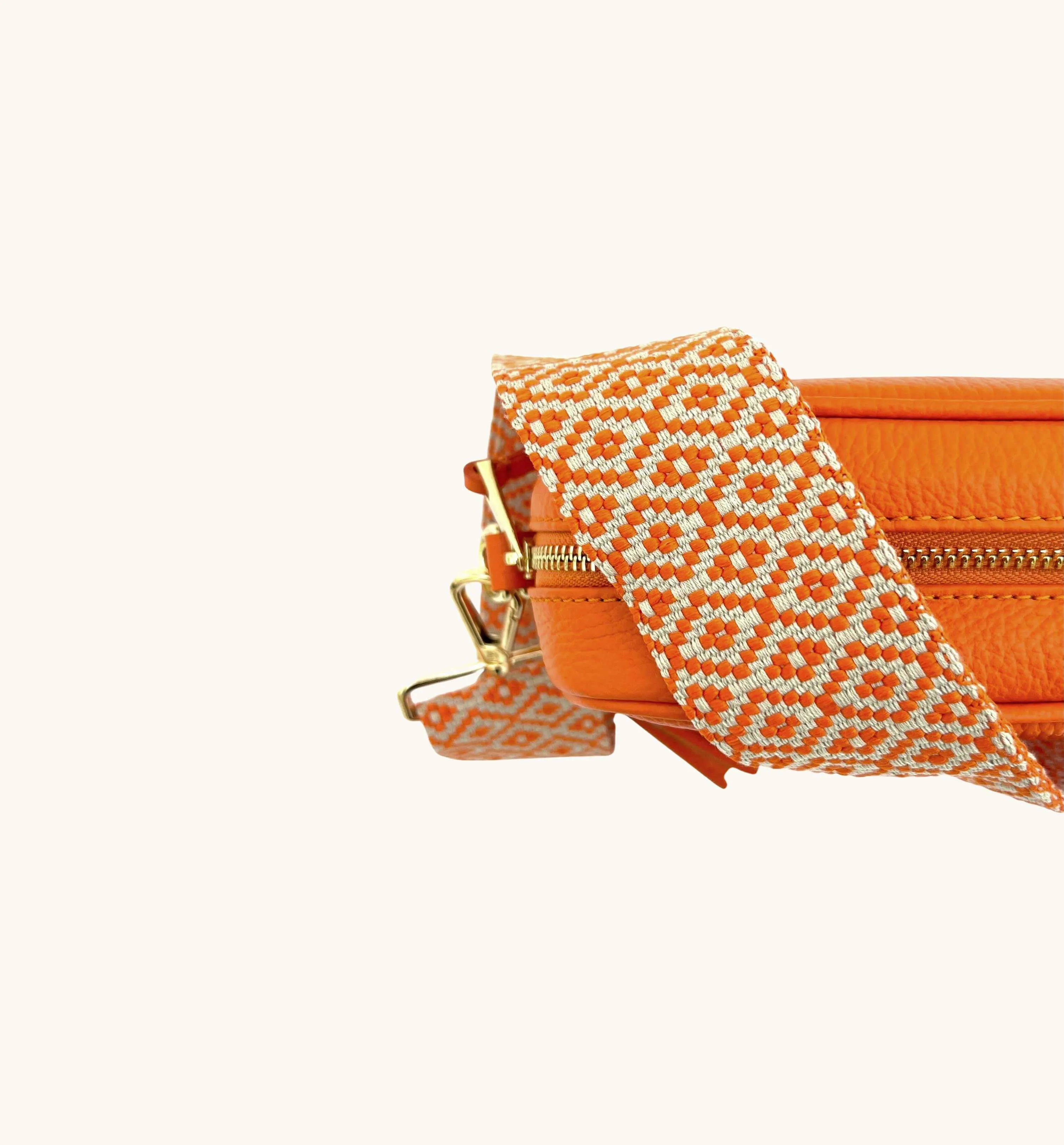 The Tassel Orange Leather Crossbody Bag With Orange Cross-Stitch Strap