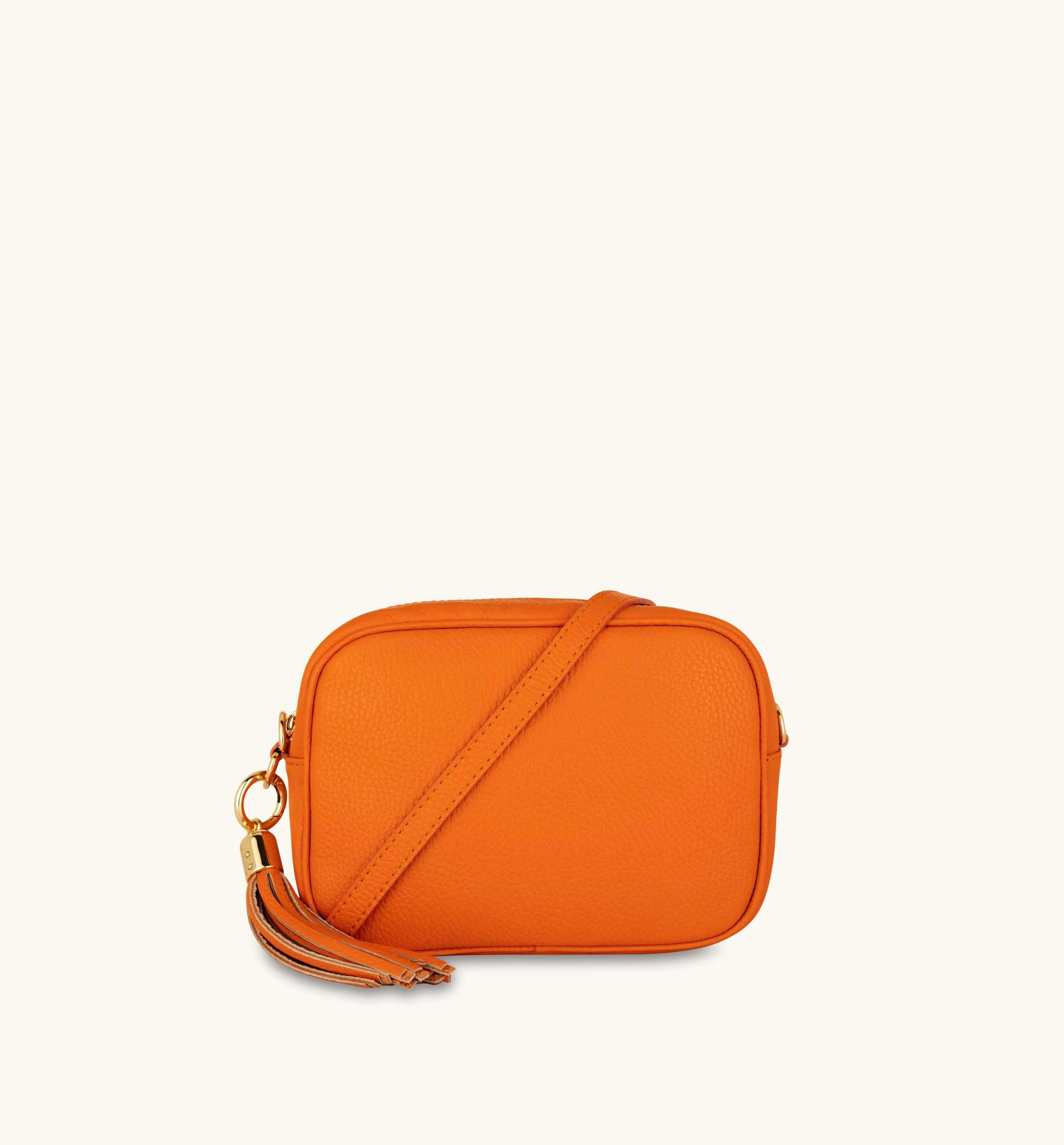 The Tassel Orange Leather Crossbody Bag With Orange Cross-Stitch Strap